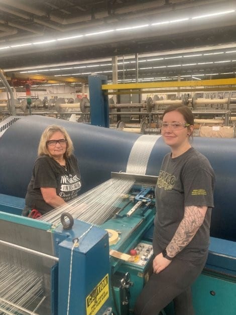 Two JPS weavers at a loom on the Anderson floor